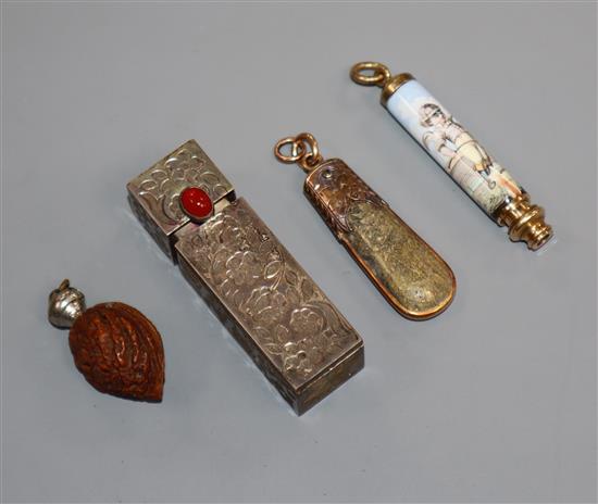 A Stanhope walnut pendant, an enamelled propelling pencil, a hardstone pendant and a lipstick holder with mirror.